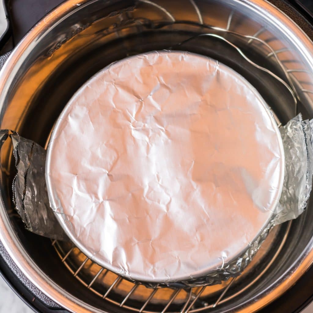 instant pot cheesecake in a foil covered pan