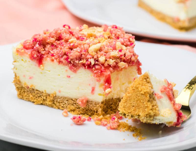 creamy Strawberry Crunch Cheesecake on a plate