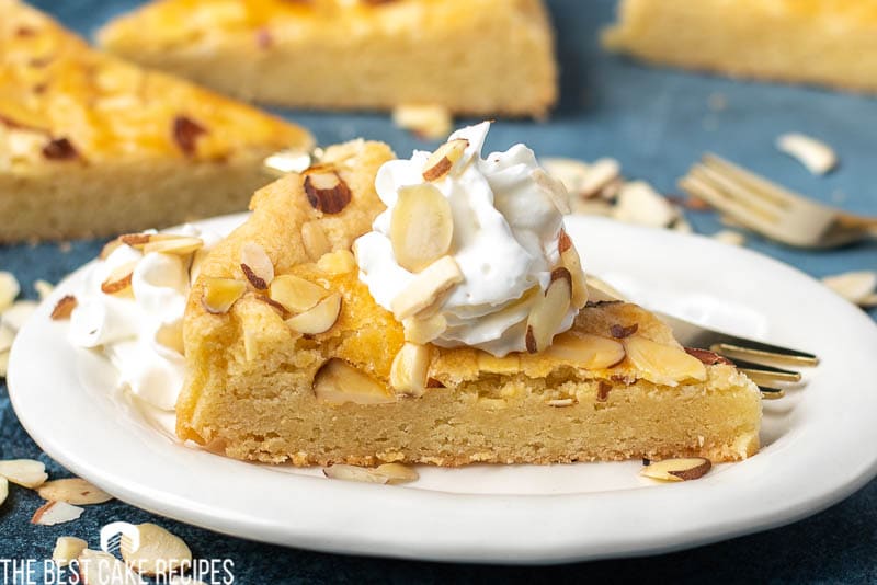 slice of butter cake on a plate with whipped cream