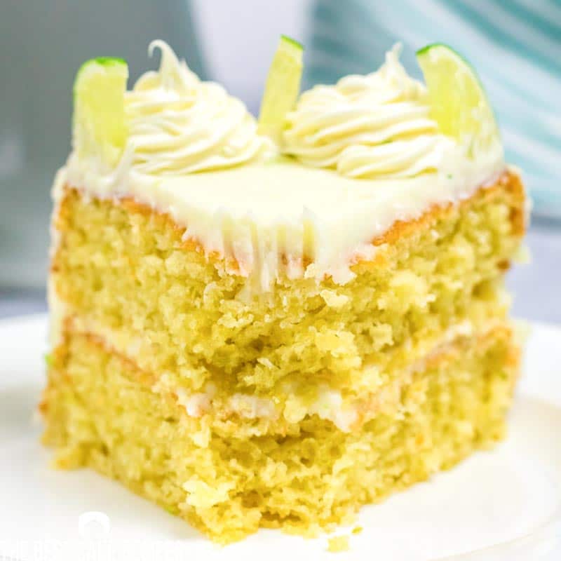 Slice of key lime cake with fork full out of it