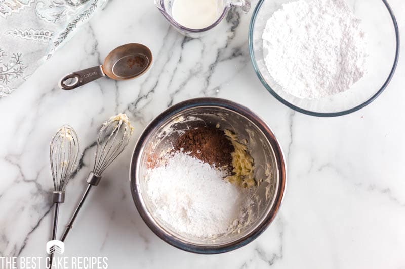 mixing bowls with powdered sugar and cocoa powder