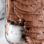 mississippi mud cake in a baking pan with a slice out