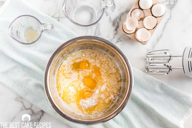cake mix with eggs and butter in a mixing bowl