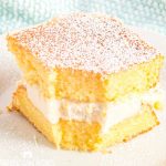 square of Homemade Twinkie Cake with a bite out of it