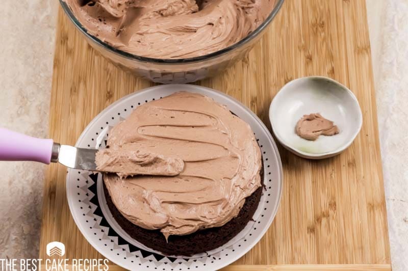 frosting spreading on a chocolate cake