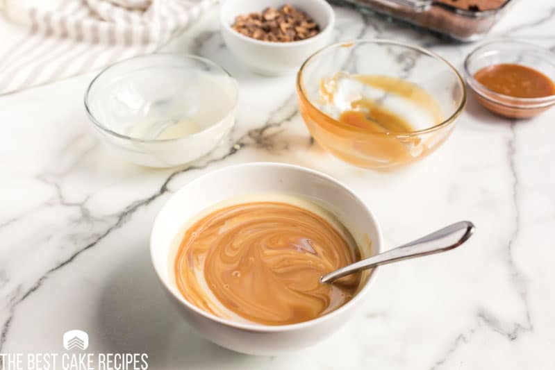 caramel topping and condensed milk mixed in a bowl