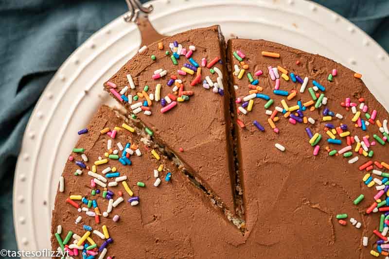 cake with chocolate frosting with one slice cut