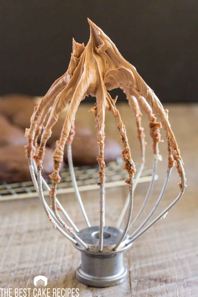 mocha frosting on a stand mixer whisk