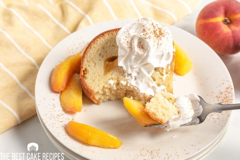 slice of peach pound cake with a bite on a fork