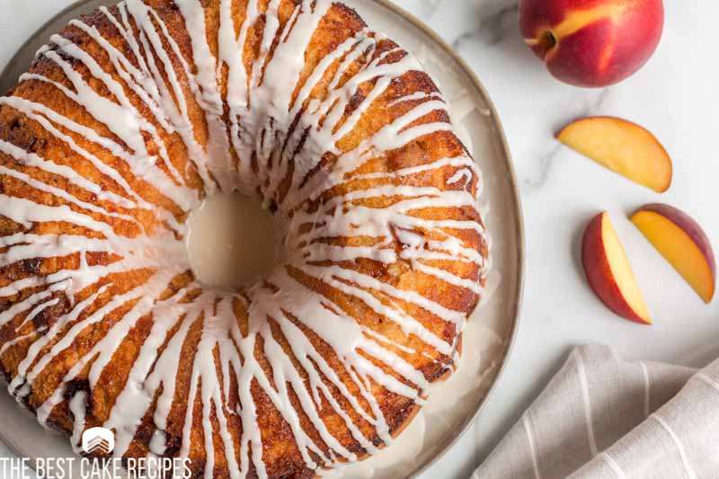 overhead view of glazed peach swirl bundt cake