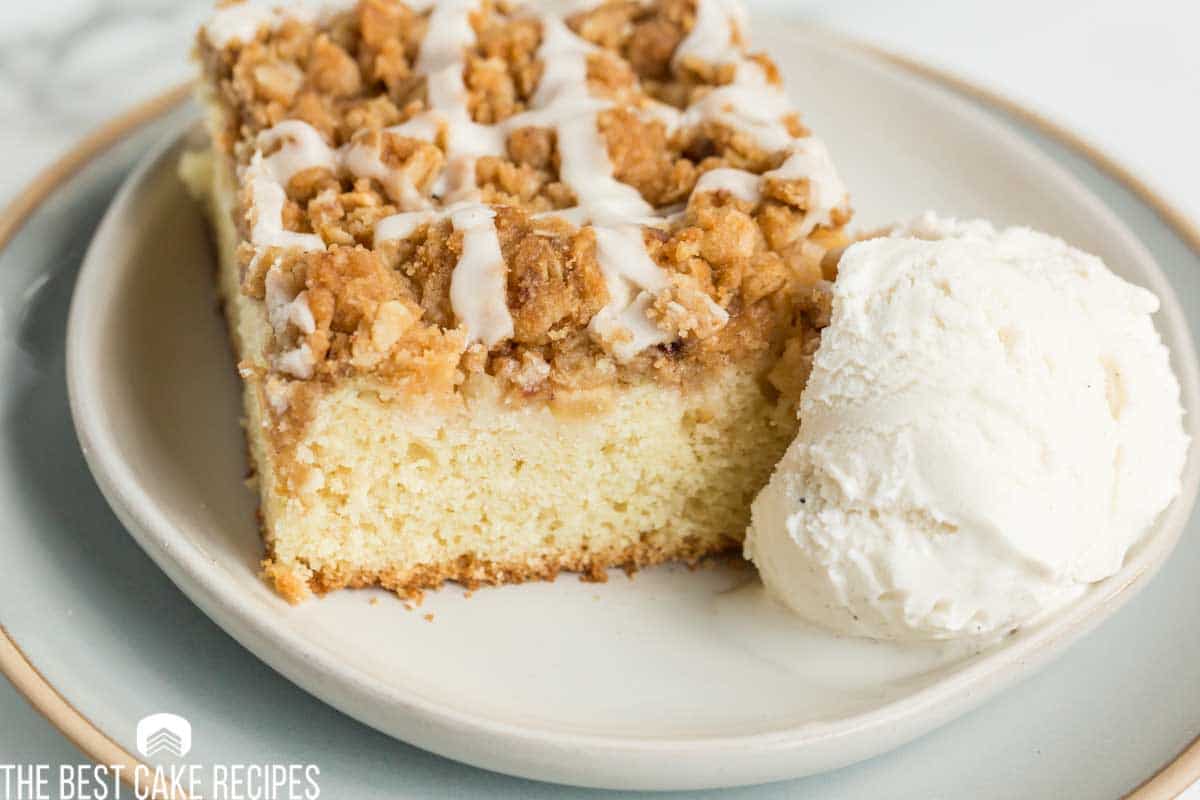 apple crisp coffee cake on a plate with ice cream