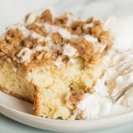 apple crisp coffee cake on a plate with a fork