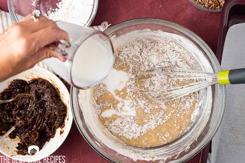 pouring buttermilk into cake batter