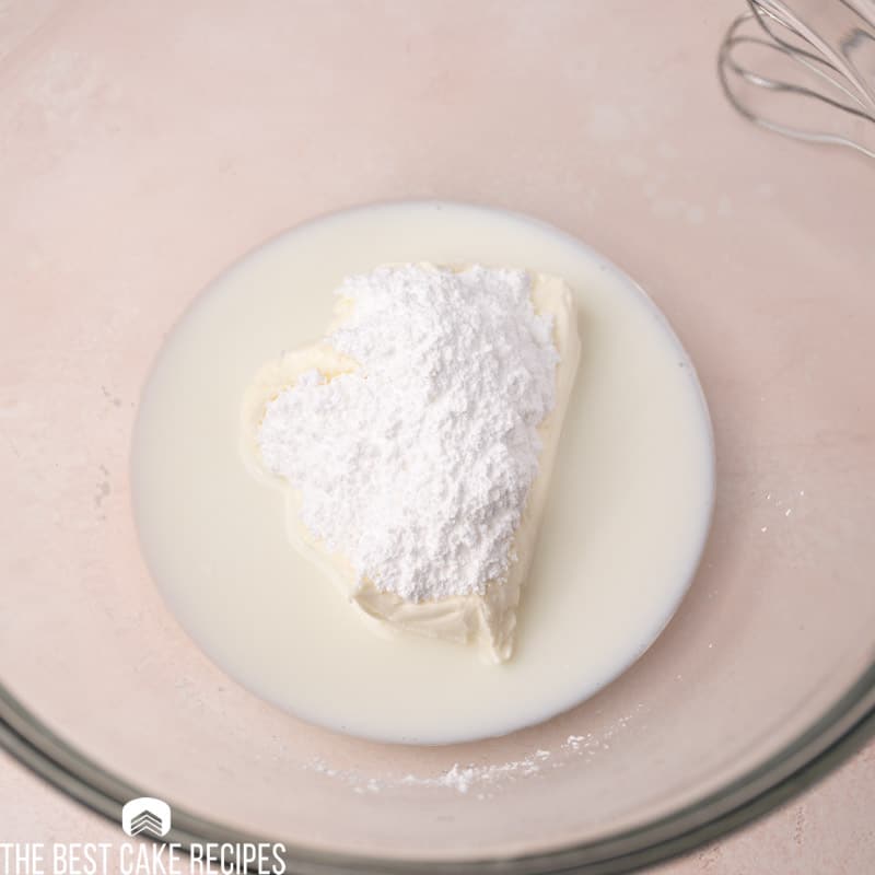cream cheese, milk and sugar in a bowl