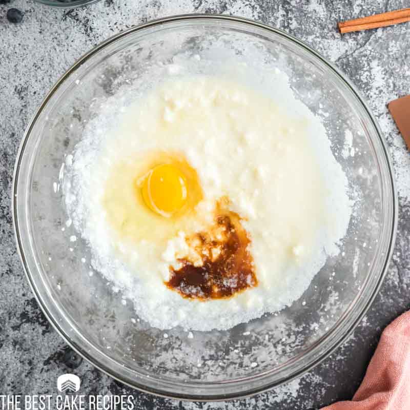 yogurt, sugar, egg and vanilla in a bowl