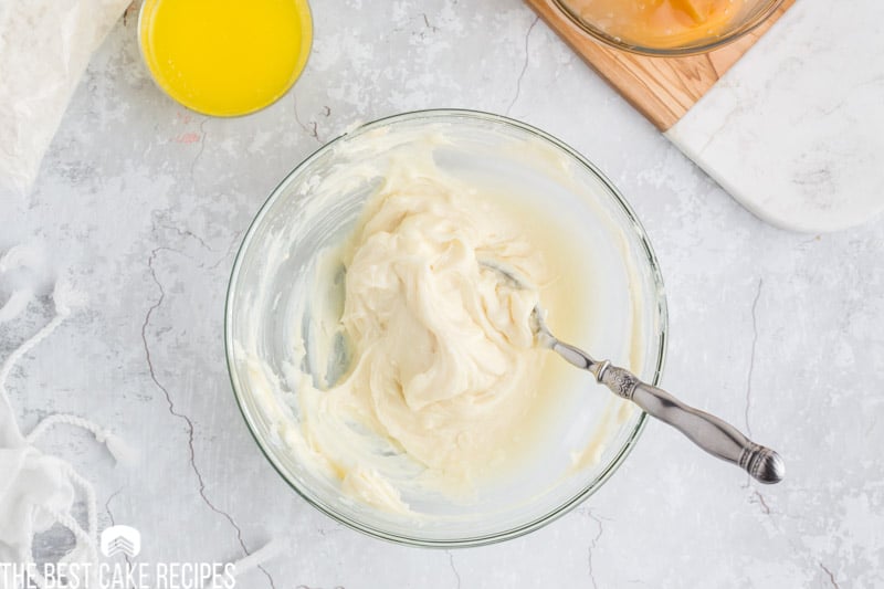 cream cheese and sugar in a mixing bowl
