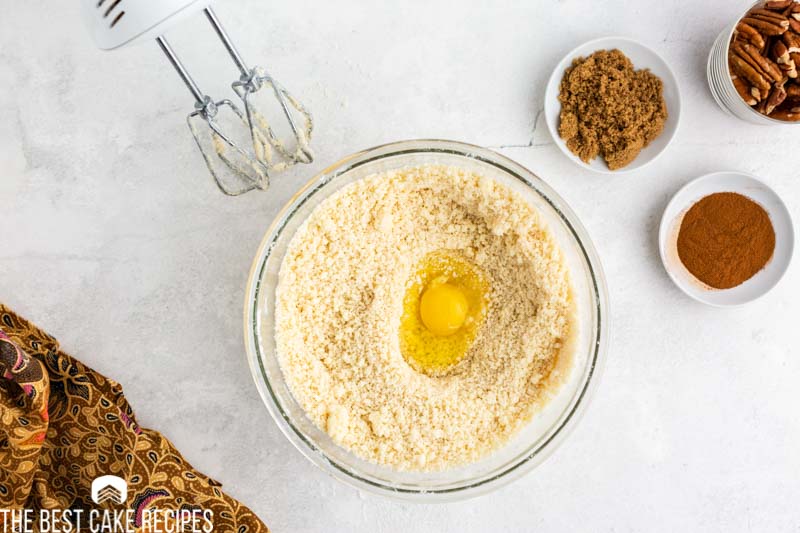 dry cake mix with egg in bowl