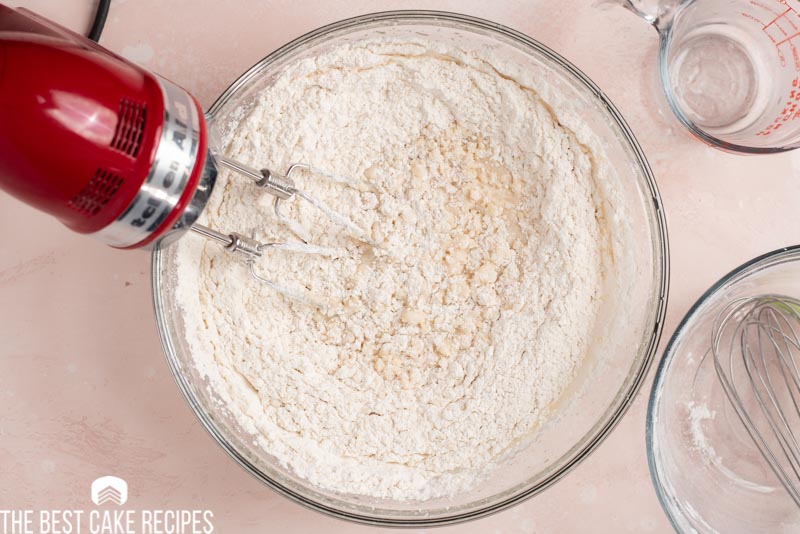 mixing flour into cake batter