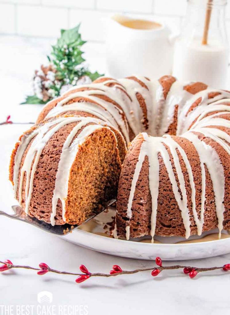 gingerbread bundt cake with one slice on a spatula