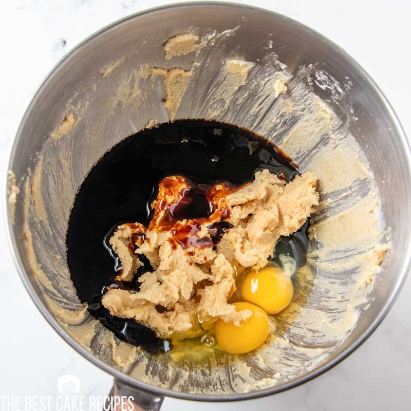 unmixed cake batter with molasses and eggs in a mixing bowl