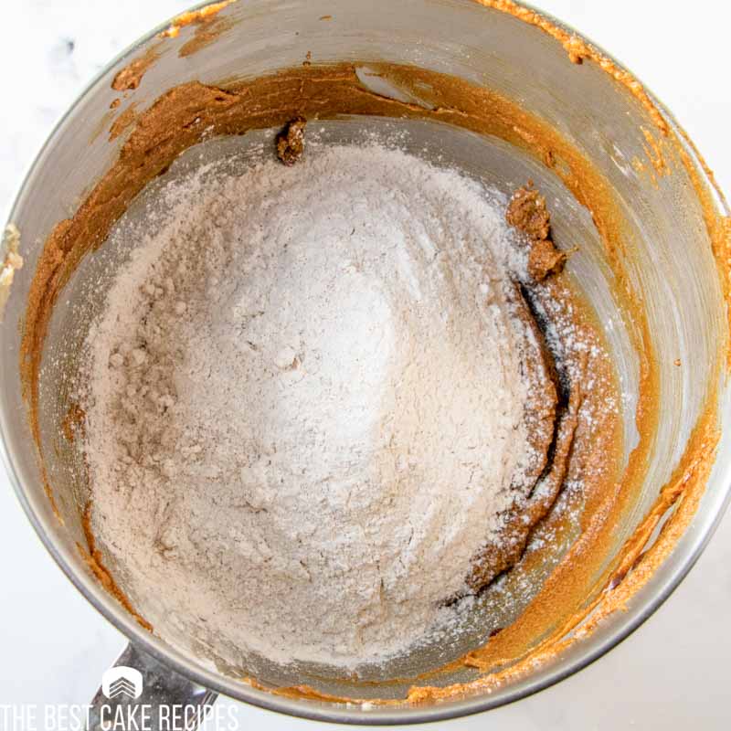 flour on cake batter in a mixing bowl