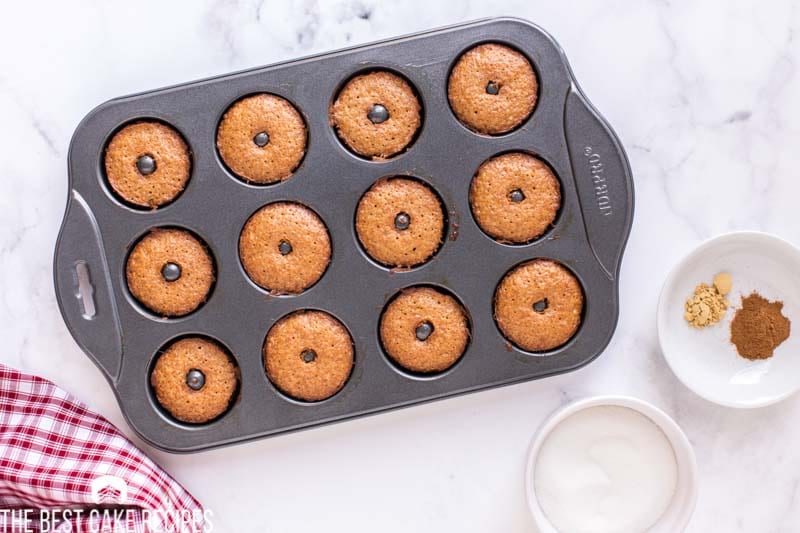 overhead view of baked donuts in a pan