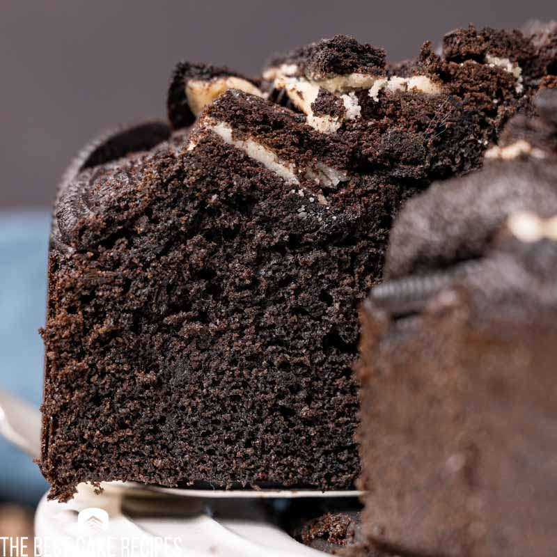 chocolate cake with oreos on top on a spatula