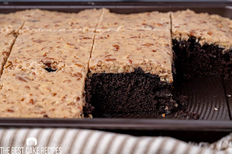 chocolate cake with praline frosting in a baking pan