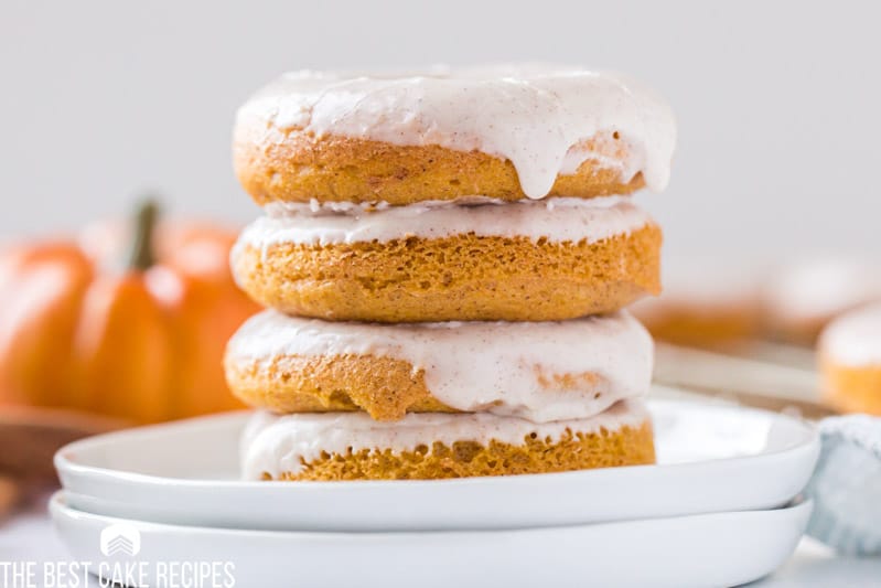 stack of 4 pumpkin cake mix donuts on a plate