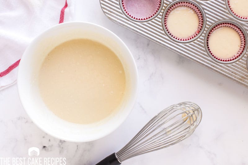 cupcake batter in a bowl with a whisk