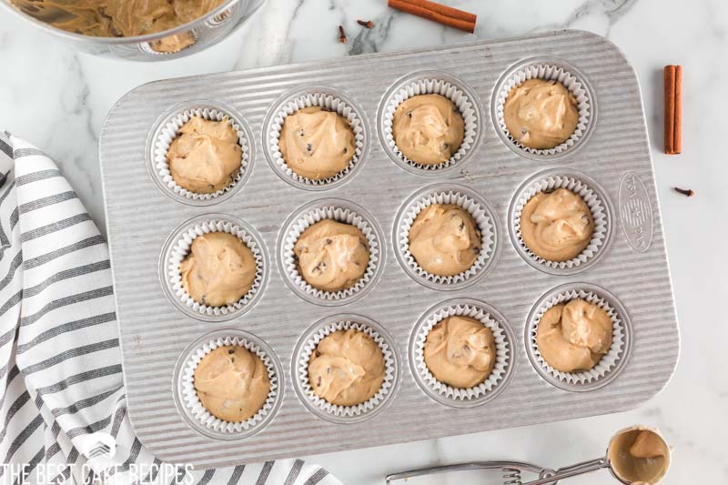 overhead view of unbaked spice cupcakes in a cupcake pan