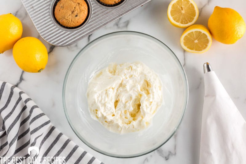 overhead view of lemon frosting in a mixing bowl