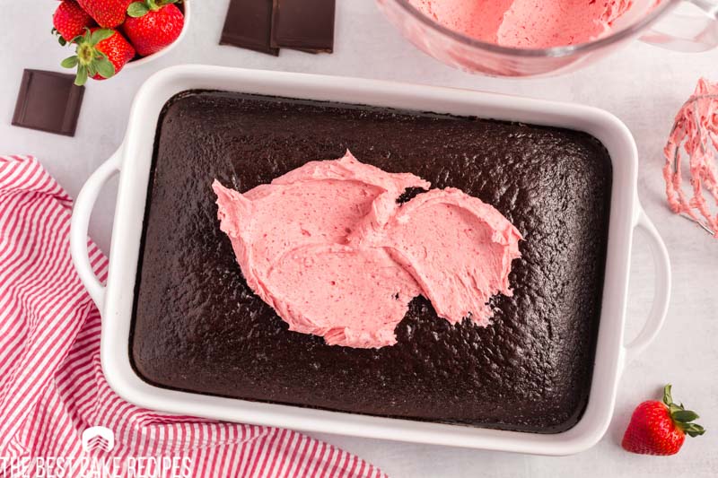 strawberry frosting on a chocolate cake