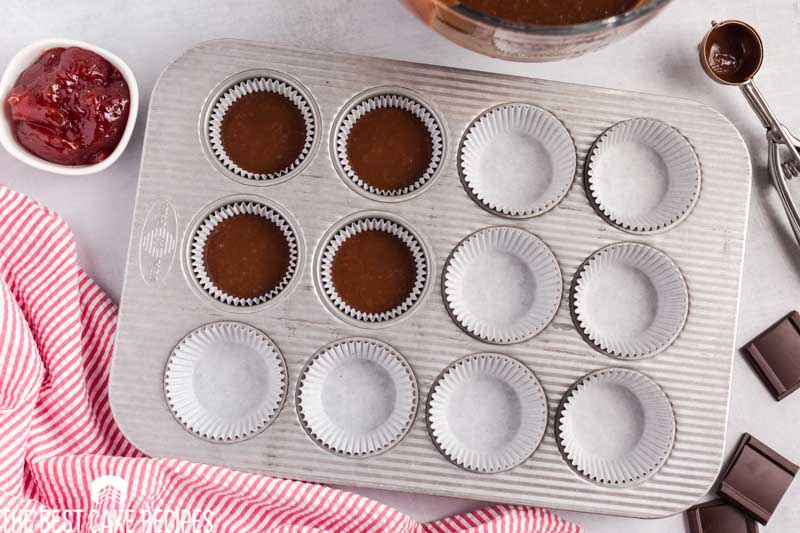 unbaked chocolate cupcakes in a pan