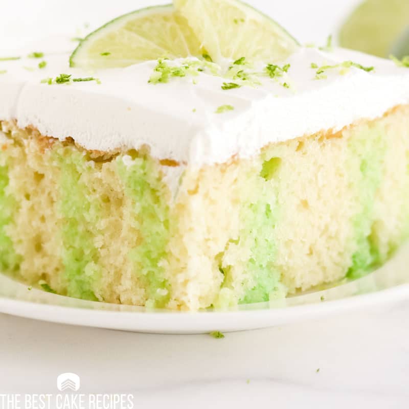 a closeup of a piece of lime poke cake