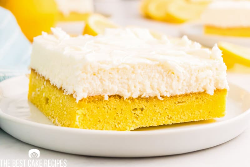 cream cheese frosted lemon bar on a plate