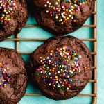 chocolate cookies with sprinkles on a wire rack