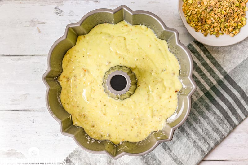 pistachio pudding cake batter in a pan