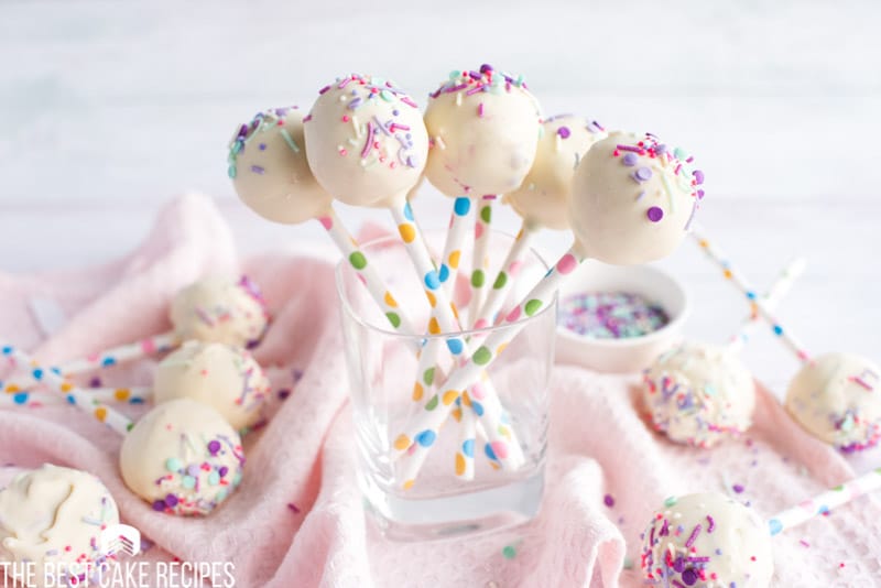 table with cake pops and sprinkles