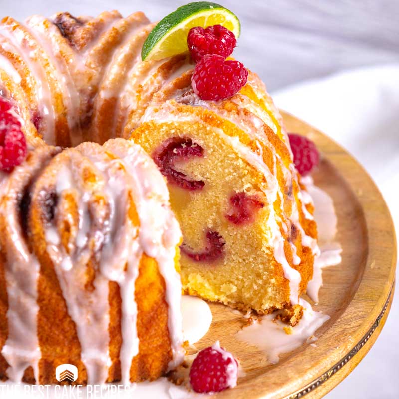 a raspberry bundt cake with one slice missing