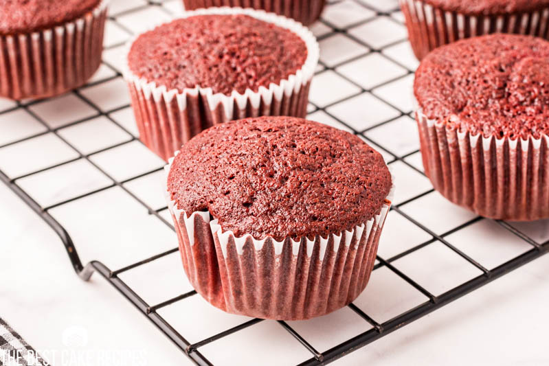 unfrosted cupcakes on a wire rack