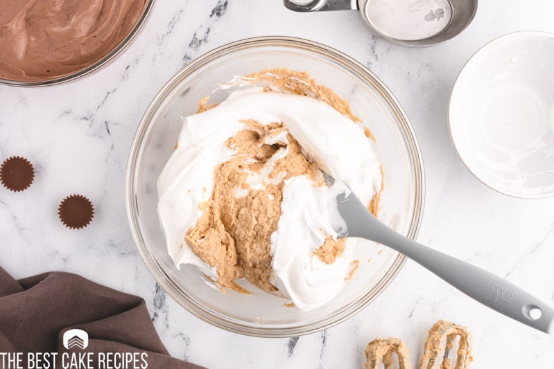 mixing cool whip into peanut butter mixture