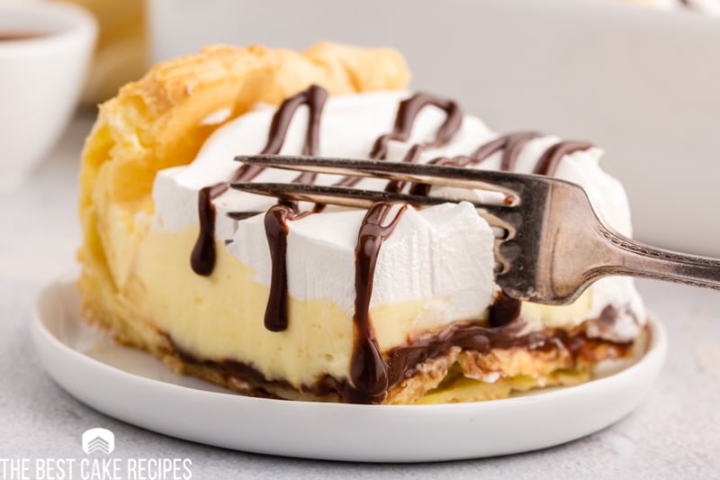 cream puff cake on a plate with a fork