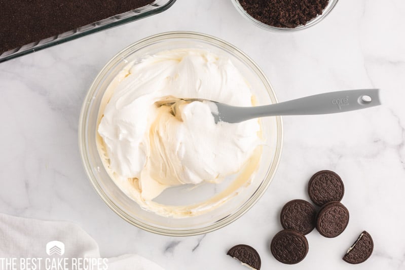 mixing whipped cream into cream cheese