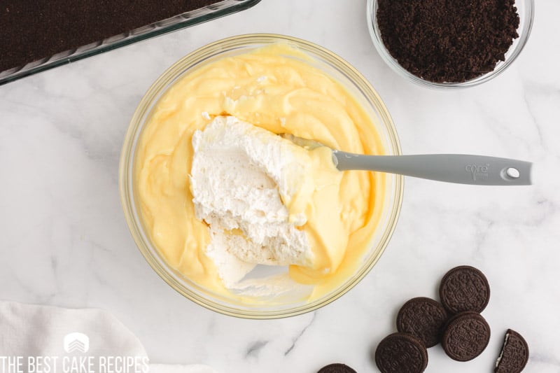 mixing whipped cream into pudding