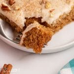 closeup of a piece of apple butter cake with a fork