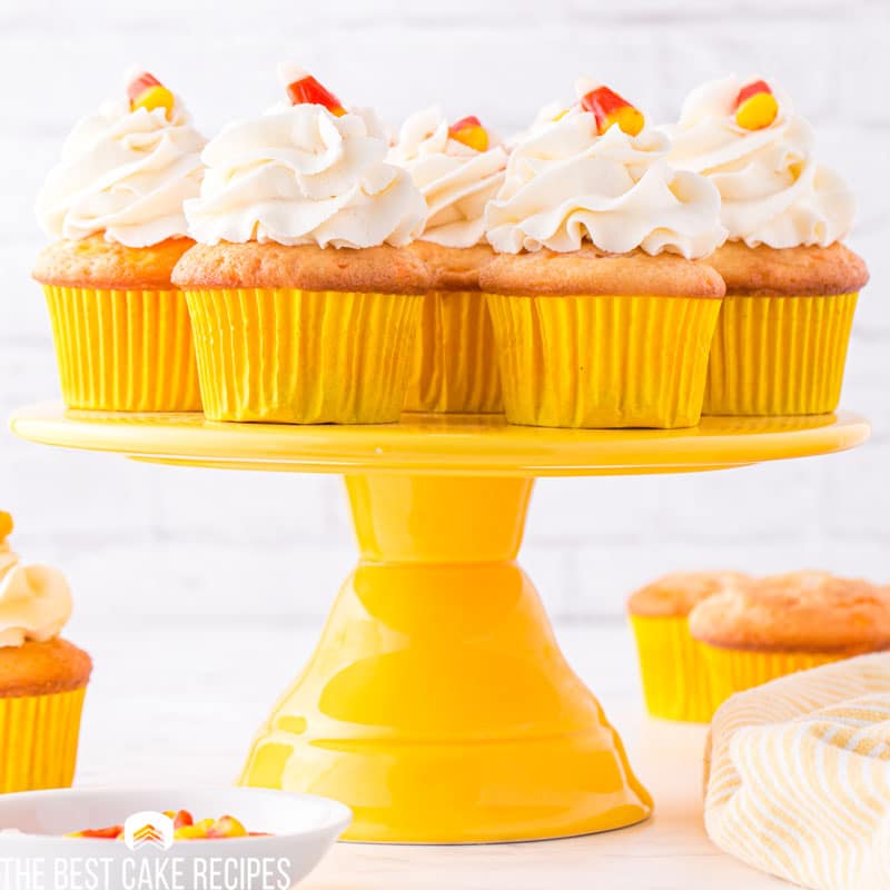 candy corn cupcakes on a cake stand