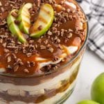 layered dessert with caramel, cake and apples