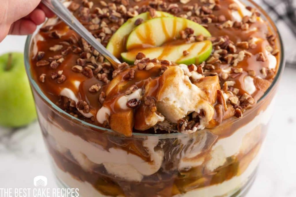 caramel apple trifle with a serving spoon