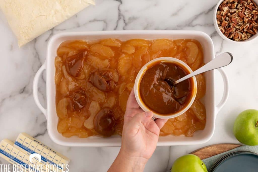 caramel in a bowl over apples